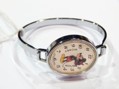 Swiss chrome Mickey Mouse watch with Mickey Mouse figure to the oval dial, hands in form of his arms