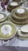 Royal Worcester "Balmoral" pattern part dinner service in green and gilt,