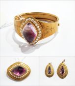 Victorian suite of seedpearl and amethyst-coloured jewellery to include bangle, brooch and pendant,
