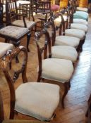 Set of six Victorian carved rosewood balloon back dining chairs with C-scroll crestrails,