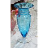 Tall blue glass vase with everted rim, panelled and tapering body,