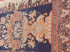 Silk prayer rug, the blue ground with flower vase, central medallion, running floral border (worn),