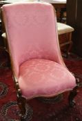 Victorian rosewood spoon-back chair with carved cabriole legs,