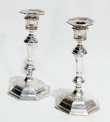 Matched pair of candlesticks, London mark (marks worn) with tapered and fluted stem,