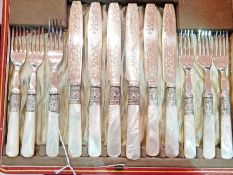 Set of six mother-of-pearl handled silver plated dessert eaters with engraved blades,