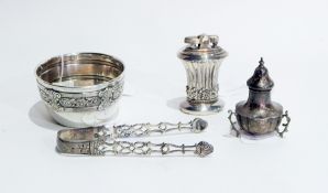 White metal sugar bowl with foliate decoration, silver pepperpot,