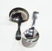 George III silver fiddle pattern caddy spoon, London 1819 and another,