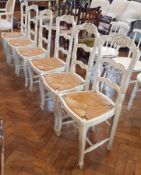 Set of six continental white painted ladderback dining chairs with drop-in rush seats,