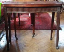 Mahogany fold-over top card table, serpentine edge, fluted frieze,