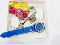 Lady's Geneva blue and diamante watch, two other coloured watches,