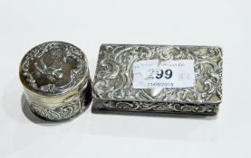 Silver rectangular pill box of repousse scrollwork design,