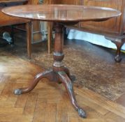 Georgian style mahogany circular dished top tripod table on turned column with carved splayed legs,