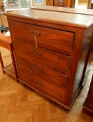 A hardwood chest of drawers, with moulded edge top, four long drawers on bun feet,