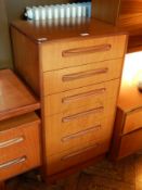 G-Plan matching chest of six short drawers, raised on a plinth base,