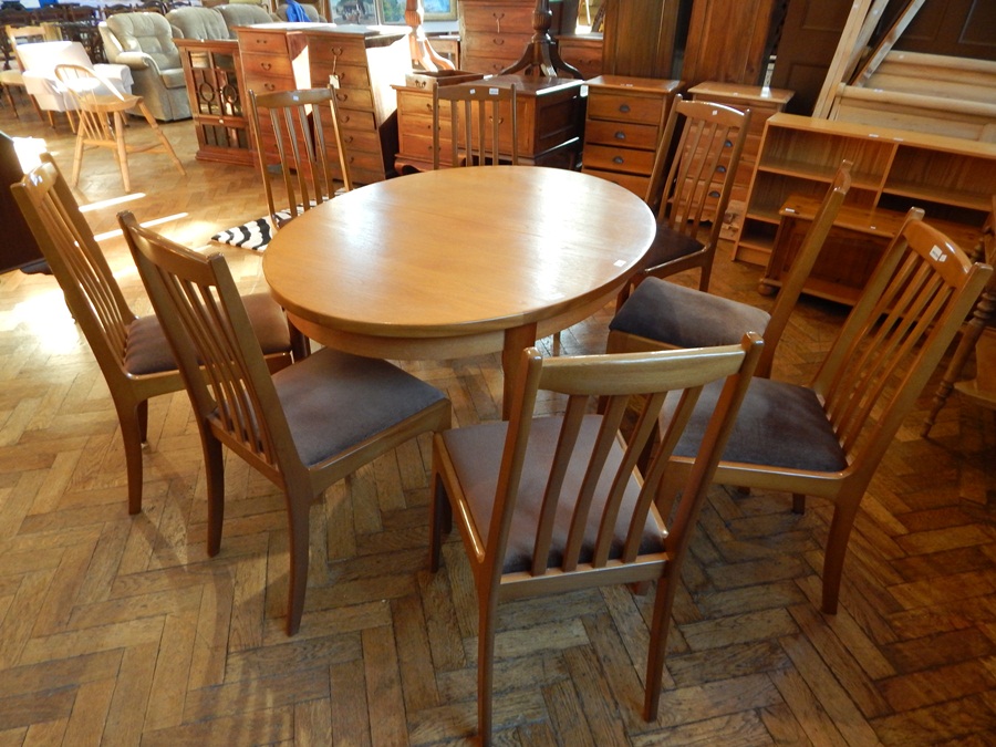 A modern open top extending dining table, with extra leaf,