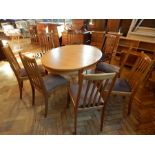 A modern open top extending dining table, with extra leaf,