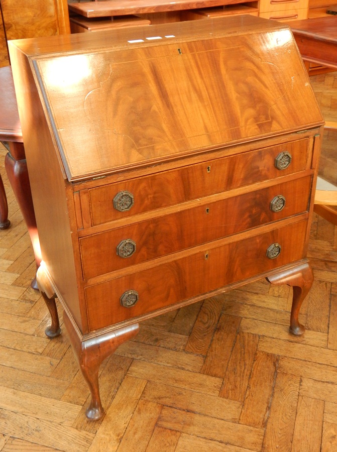 An early 20th century mahogany bureau, with fitted interior,