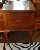 A mahogany filing cabinet, with moulded edge top, with a drawer fitted with a folder tray,