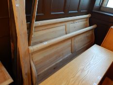 A pine bateau lit double bed, with panelled boards,