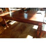 An Eastern hardwood rectangular top dining table with moulded edge top, plain frieze,