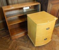 A modern light wood bowfront two-drawer filing cabinet,