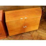 A modern hardwood side cupboard with two drawers, and the top with bowfront shaped corner,