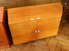 A modern hardwood side cupboard with two drawers, and the top with bowfront shaped corner,