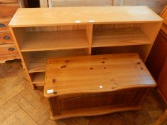 A modern pine blanket box with panel front, width 85cm, together with a six shelf open bookcase,