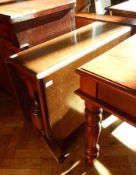 Mid 20th century oak drop flap dining table table on twin turned baluster supports,