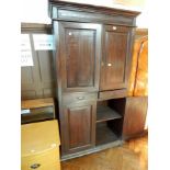 A hardwood cupboard with straight moulded pediment,