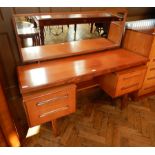 A modern teak G-Plan mirror back dressing table,