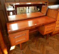 A modern teak G-Plan mirror back dressing table,