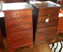 A pair of Eastern hardwood chests, of six short drawers raised on bracket feet,