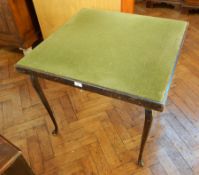 An old square-top card table lined with green baize on cabriole legs,