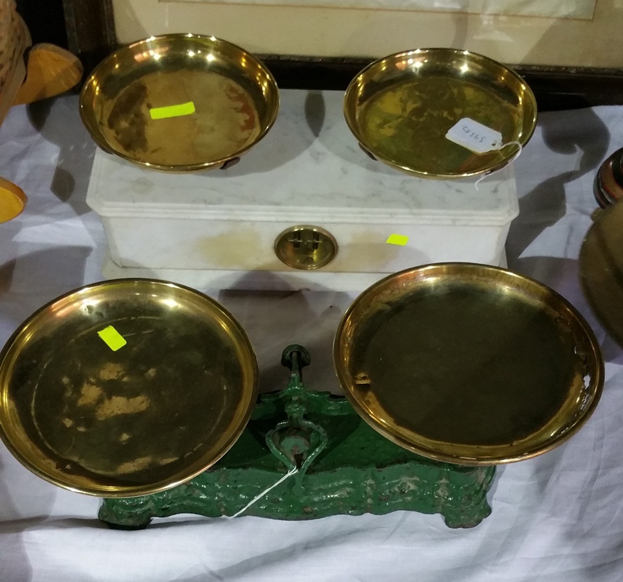 A green metal set of weighing scales and white marble set of weighing scales (2)