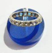 White gold-coloured metal and white sapphire full eternity ring