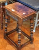 An oak joint stool with turned and bulbous supports,