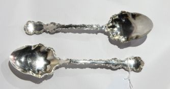 A pair of Victorian silver salad servers with scrollwork borders, Sheffield 1898, 6oz approx.