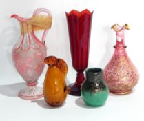 Red glass vase, tapering on circular base,