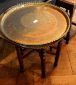 Indian brass occasional table with tray top, decorated with Arabic writing and pierced edge,