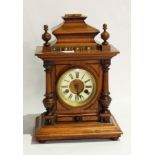 Victorian walnut mantel clock in architectural style case, with ceramic circular dial,