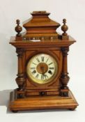 Victorian walnut mantel clock in architectural style case, with ceramic circular dial,