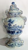 19th century Dutch delft covered vase, the cover with fruit and scroll surmount,