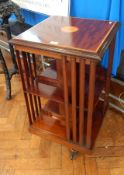 An Edwardian mahogany inlaid revolving bookcase, the top inlaid with fan pattera,