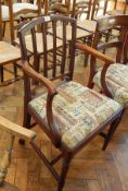 Early 19th Century mahogany open arm chair with splatback,