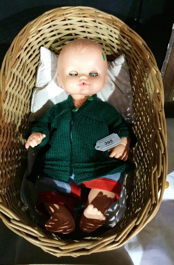 Sebino Italian vinyl baby boy doll in wicker cradle