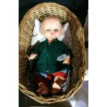 Sebino Italian vinyl baby boy doll in wicker cradle