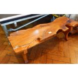 A yew wood coffee table in rustic form