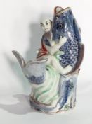 Japanese stoneware vase in the form of man wrestling with fish,
