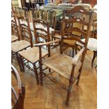 Harlequin set of seven oak ladderback dining chairs with rush seats,